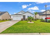 Charming house with a landscaped lawn and attached garage at 2020 Santa Maria St., Myrtle Beach, SC 29579