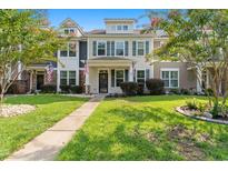 Two-story home with landscaped yard and walkway at 444 Papyrus Circle # 444, Little River, SC 29566