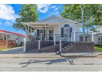 One-story home with a covered porch and ramp access at 6001 - 1819 S Kings Hwy., Myrtle Beach, SC 29575