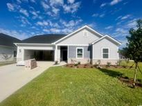 Newly built home with two-car garage and landscaping at 616 Blackthorne Circle Nw, Calabash, NC 28467