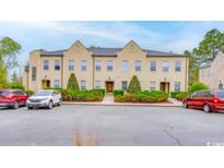 Front view of three-unit townhouse building at 4508-E Ailsa Ct. # 4508-E, Myrtle Beach, SC 29579