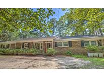 Brick ranch home with front porch and landscaping at 263 Arcadia Dr., Pawleys Island, SC 29585