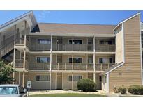 Tan multi-story building with balconies at 1025 Plantation Dr. W # 3421, Little River, SC 29566
