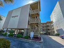 Seafarer Condos exterior view, showing building and parking at 4305 S Ocean Blvd. # 106, North Myrtle Beach, SC 29582