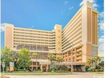 High rise hotel building with lush landscaping at 6900 Ocean Blvd. # 936, Myrtle Beach, SC 29572