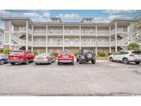 Three-story building exterior with ample parking at 800 Crumpet Ct. # 1122, Myrtle Beach, SC 29579