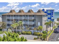 Oceanfront view of Last Resort, featuring multiple buildings and parking at 217 S Ocean Blvd. # 201, Surfside Beach, SC 29575