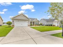 Two-story house with attached garage and manicured lawn at 1459 Tiger Grand Dr., Conway, SC 29526
