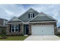 Two-story home with gray siding and stone accents at 691 Covington Dr. Nw, Calabash, NC 28467