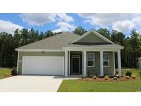 Single-story house with green siding and white garage at 577 Black Pearl Way, Myrtle Beach, SC 29588