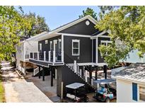 Two-story home with elevated deck and carport at 6001-N37 S Kings Hwy., Myrtle Beach, SC 29575