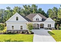 Two story home with gray siding, stone accents and a large yard at 1012 Maccoa Dr., Conway, SC 29526