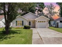Charming one-story house with a driveway and landscaped lawn at 6458 Sweet Gum Trail, Myrtle Beach, SC 29588