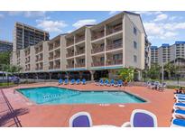 Resort-style pool with plenty of seating at 202 75Th Ave N # 5706/5707, Myrtle Beach, SC 29572