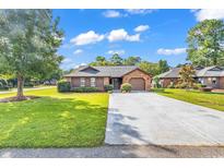 House exterior view with driveway and lawn at 211 Cedar Ridge Ln., Conway, SC 29526