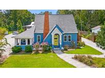 Charming blue house with gray roof, walkway, and landscaping at 4842 Main St. N, Loris, SC 29569