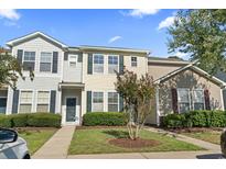 Attractive townhouse with landscaping and a welcoming entryway at 144 Olde Towne Way # 5, Myrtle Beach, SC 29588