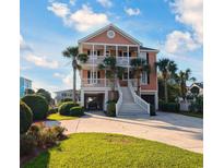 Two story home with front porch and landscaping at 758 Parker Dr., Pawleys Island, SC 29585