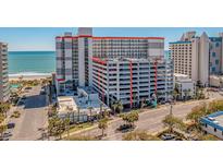 Oceanfront building with parking and ground-level businesses at 7200 N Ocean Blvd. # 260, Myrtle Beach, SC 29572