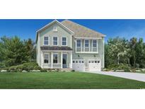 Two story house with light green siding and two car garage at 1035 Milford Way, Myrtle Beach, SC 29588