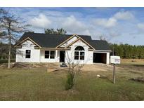 Newly constructed home with white siding and a gray roof at 4512 Old Tram Rd., Conway, SC 29527