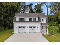 Two-story white barn-style house with double garage at 1612 16Th Ave., Conway, SC 29526