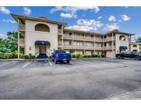 Two-story building with ample parking and a well-maintained exterior at 4103 Pinehurst Circle # Bb-11, Little River, SC 29566