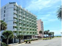 Exterior view of Caravelle Resort, featuring a multi-story building with balconies and ocean views at 7000 N Ocean Blvd. # 433, Myrtle Beach, SC 29572