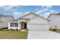 Charming one-story home with a two-car garage and well-manicured lawn at 8811 Smithfield Dr. Nw, Calabash, NC 28467