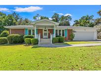 Brick ranch house with attached garage at 4133 Schoolhouse Circle, Little River, SC 29566