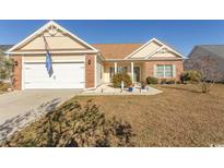 Attractive one-story home with a two-car garage and well-manicured lawn at 1417 Tiger Grand Dr., Conway, SC 29526