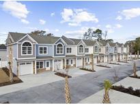 Row of new townhouses with attached garages at 900 62Nd Ave. N # 01/A, Myrtle Beach, SC 29572