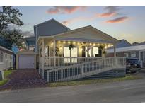 Charming beach cottage with ramp access, porch, and attached garage at 6001-5027 S Kings Hwy., Myrtle Beach, SC 29575
