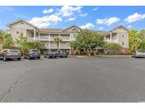 Two-story apartment building with ample parking at 5801 Oyster Catcher Dr. # 1923, North Myrtle Beach, SC 29582