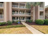 Attractive building exterior with landscaping at 366 Pinehurst Ln. # 13D, Pawleys Island, SC 29585