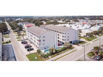 Aerial view of a two-story building with a pool at 1509 N Waccamaw Dr. # 112, Murrells Inlet, SC 29576