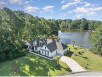 Aerial view of a single Gathering home on a lake at 1886 Southwood Dr., Myrtle Beach, SC 29575