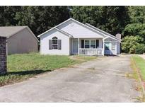 Single-story home with a front porch and small yard at 7990 Short Needle Ct., Murrells Inlet, SC 29576