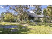 Ranch-style house with green exterior and large yard at 4605 Hickory Holt Rd., Galivants Ferry, SC 29544