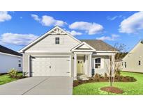 Craftsman style home with attached garage and landscaped lawn at 3030 Deerberry Place, Longs, SC 29568