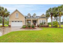 Beautiful house exterior with well-maintained landscaping and a two car garage at 3712 Faith Dr., Conway, SC 29527