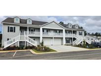 Two-story townhome with attached garage and parking at 1411 Gooseneck Place # 103, Murrells Inlet, SC 29576
