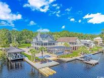Aerial view of waterfront home with private pool, dock, and boat lift at 3815 Ed Smith Ave., Myrtle Beach, SC 29588