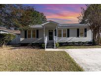 Cute one-story house with gray siding and a covered porch at 838 Marlin Ct., Murrells Inlet, SC 29576