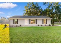 Single story house with gray siding and a front yard at 3449 Church St., Loris, SC 29569