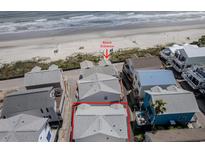 Aerial view of beach house community, highlighting a house close to beach access at 6001 S Kings Hwy., Myrtle Beach, SC 29575