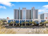 Oceanfront resort building with parking and palm trees at 2301 Ocean Blvd. S # 1218, Myrtle Beach, SC 29577
