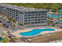 Community pool with surrounding lounge chairs at 5905 South Kings Hwy. # A246, Myrtle Beach, SC 29575