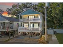 Two-story home with elevated parking and a deck at 6001 - 1870 S Kings Hwy., Myrtle Beach, SC 29575