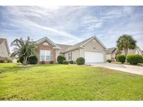 Brick and shingle ranch home with attached garage and manicured lawn at 812 Lalton Dr., Conway, SC 29526